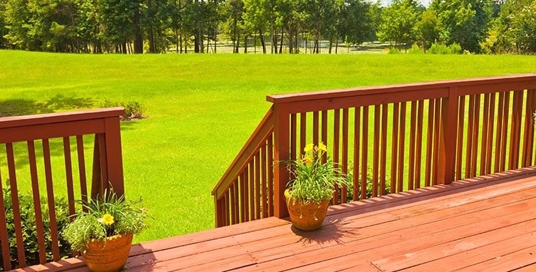 Cedar decking and railing looking out over back yard